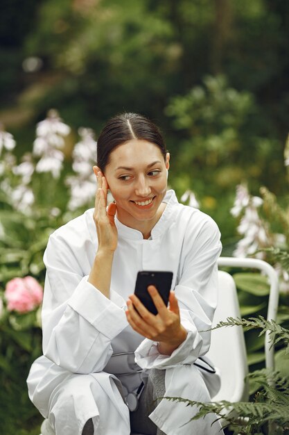 Young nurse in outdoor. Woman doctor. Image for advertising scientific developments in the food and medical industry.