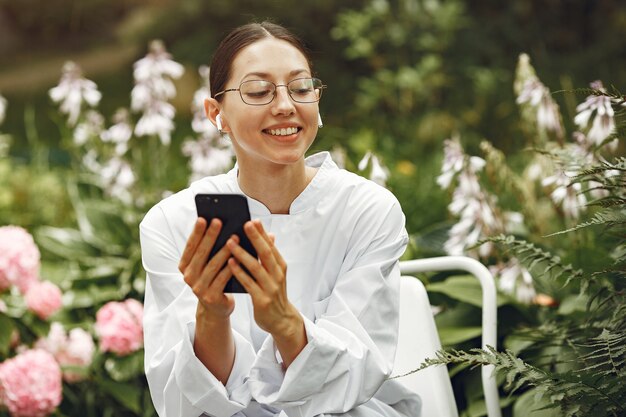 Young nurse in outdoor. Woman doctor. Image for advertising scientific developments in the food and medical industry.