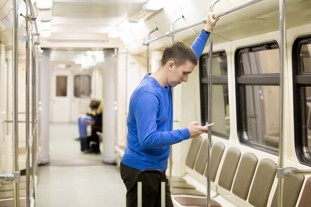 Young passenger in subway train