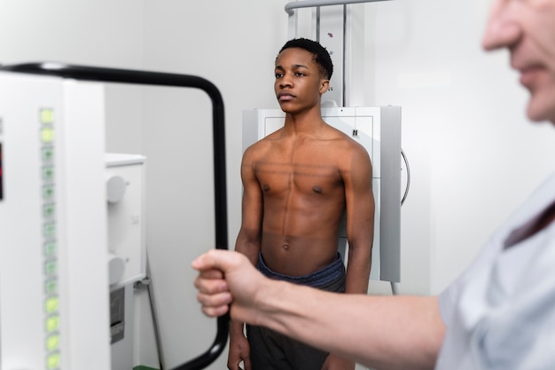 Young patient getting scan at clinic