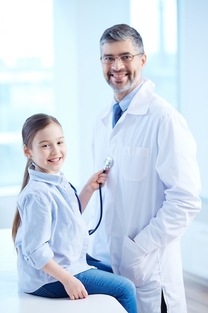 Young patient playing with a stethoscope