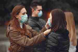 Free photo young people are spreading disposable masks outside