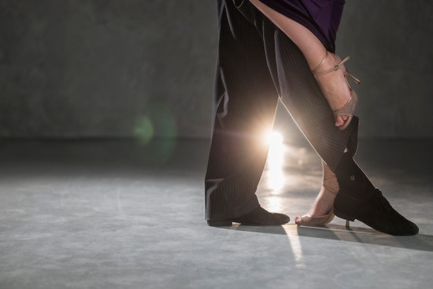 Young people dancing tango in a studio