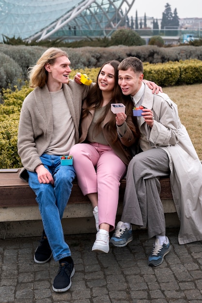 Young people eating berries in the street