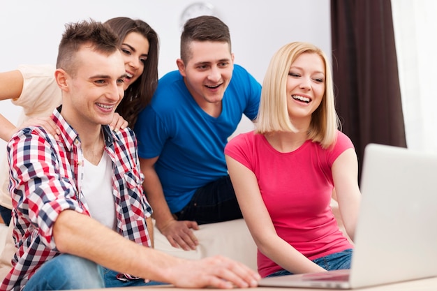 Young people enjoying free net in living room