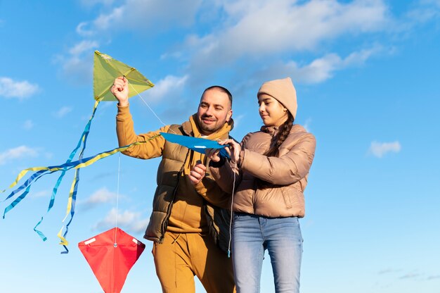 Young people getting their kite up