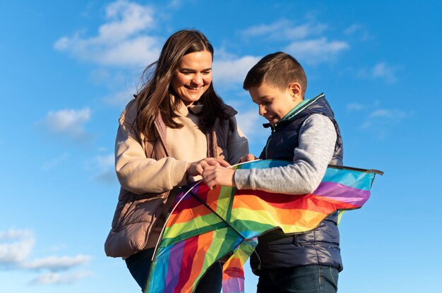 Young people getting their kite up