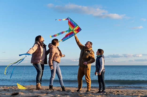 Young people getting their kite up