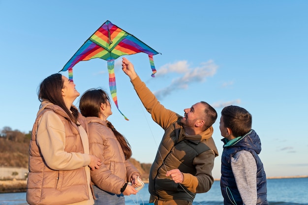 Free photo young people getting their kite up