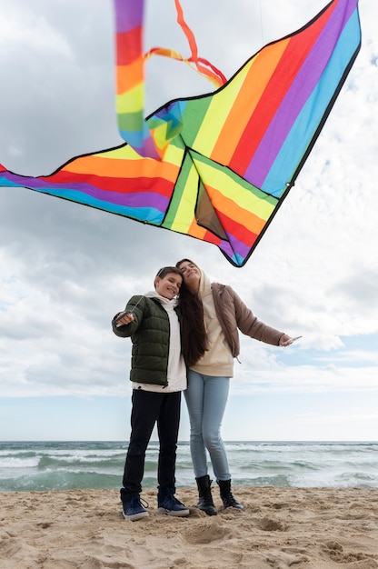 Young people getting their kite up