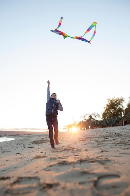 Free photo young people getting their kite up