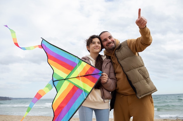 Young people getting their kite up