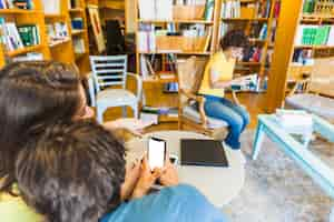 Free photo young people gossiping and shooting nerdy woman