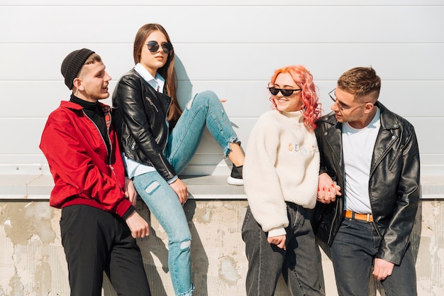 Young people hanging out together on street