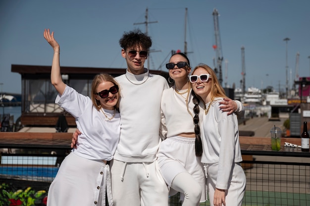 Free photo young people having fun at white party