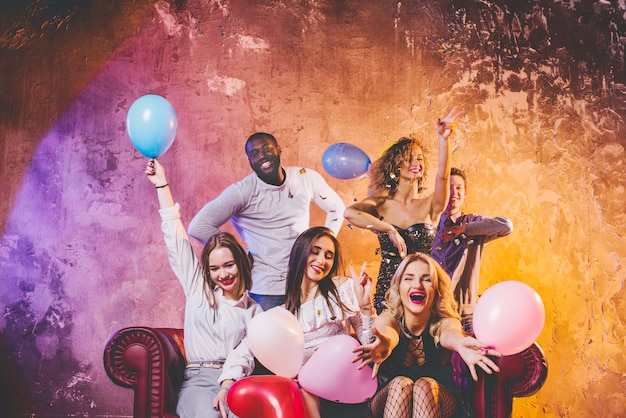 Young people having fun with balloons