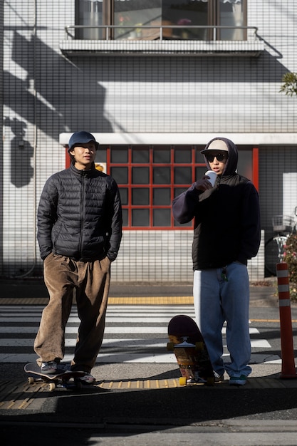 Free photo young people skateboarding in japan