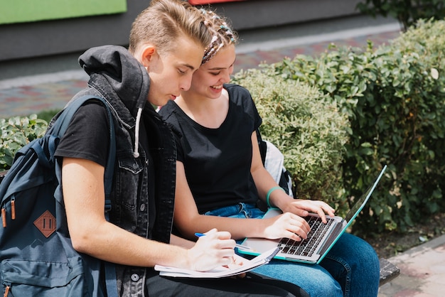 Free photo young people studying in park