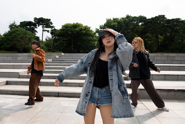 Free photo young people in urban scene with k-pop aesthetics