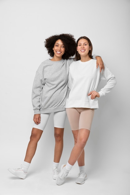 Free photo young people wearing hoodie mockup