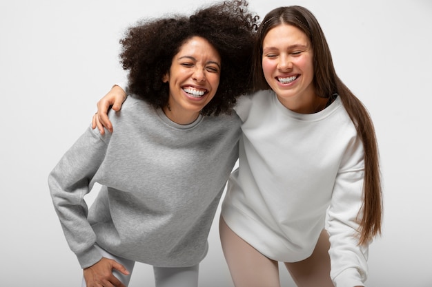 Free photo young people wearing hoodie mockup