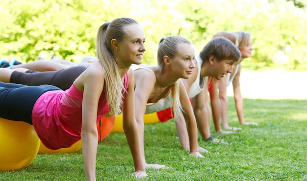 Young people working out in a park