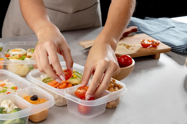 Young person practicing batch cooking with healthy food