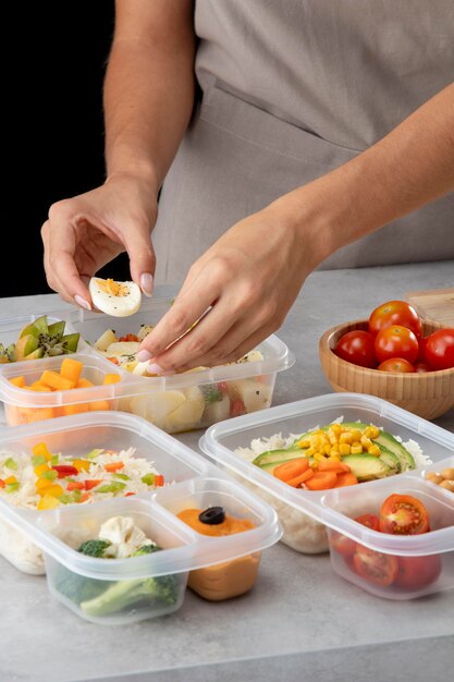 Young person practicing batch cooking with healthy food