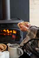 Free photo young person relaxing with hot coffee