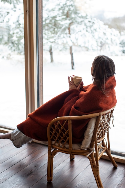 Young person relaxing with hot coffee