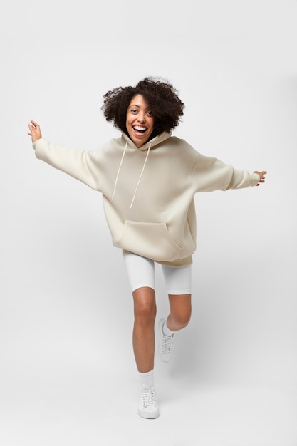 Free photo young person wearing hoodie mockup