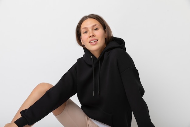 Free photo young person wearing hoodie mockup