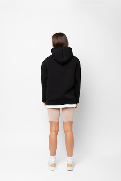 Free photo young person wearing hoodie mockup