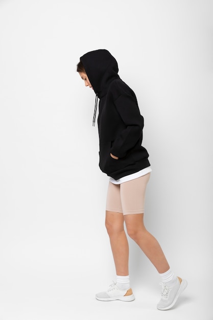 Free photo young person wearing hoodie mockup