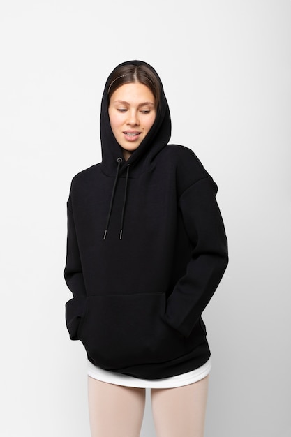 Free photo young person wearing hoodie mockup