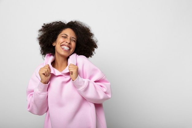 Free photo young person wearing hoodie mockup