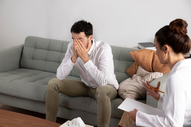 Free Photo young person with anxiety talking to specialist