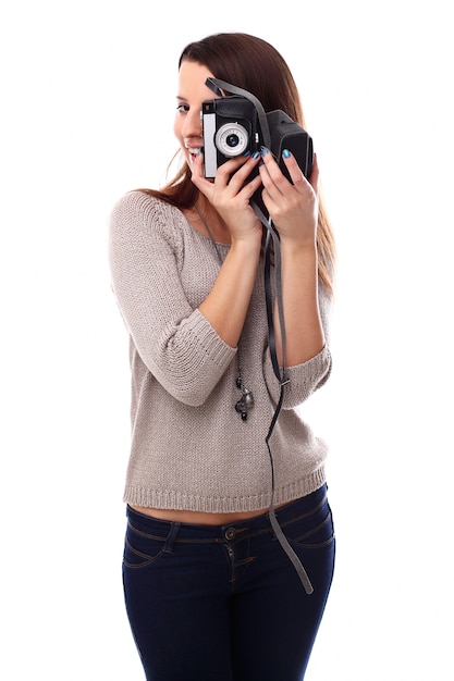 Young photographer woman with vintage analog camera
