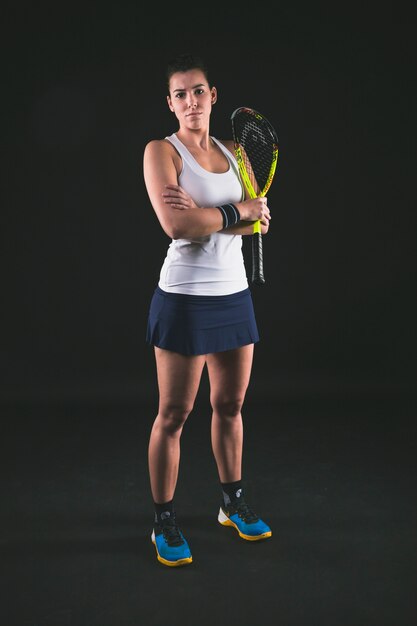 Young player holding her squash racket