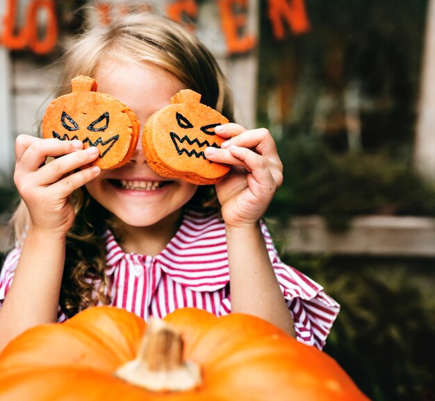 Young playful girl enjoying the Halloween festival