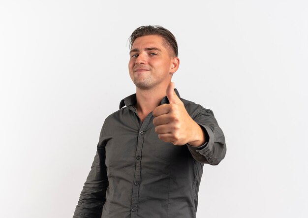 Young pleased blonde handsome man thumbs up isolated on white background with copy space