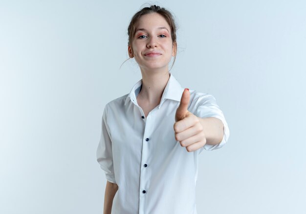 young pleased blonde russian girl thumbs up isolated on white background with copy space