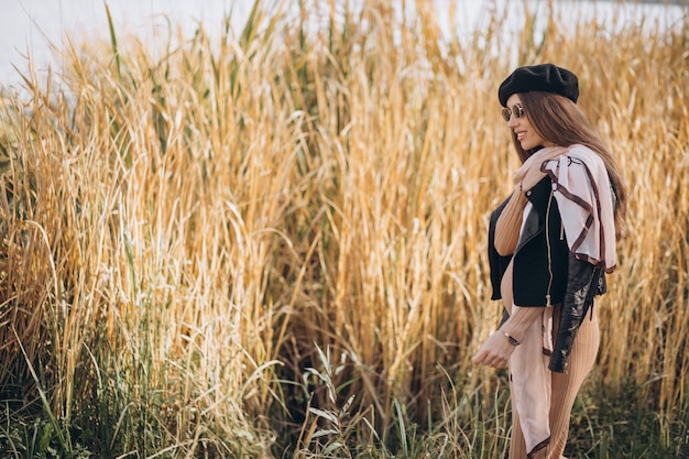 Young pregnant woman walking in nature