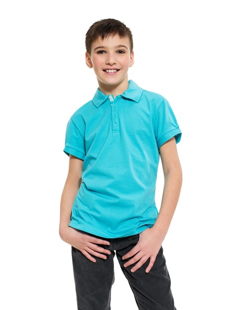 Young pretty boy posing at studio as a fashion model. Photo of preschooler 8 years old over white