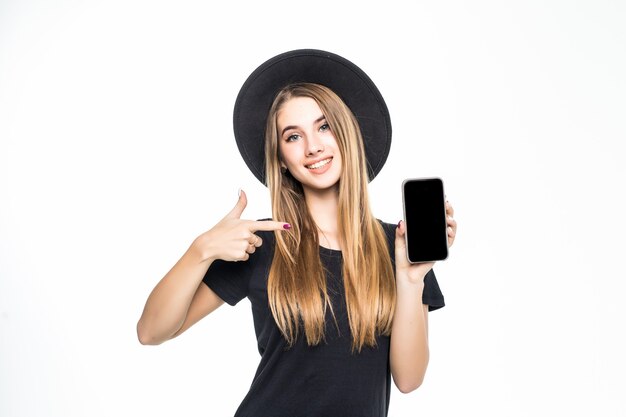 Young pretty cute girl shows on mobile phone screen isolated on a white background