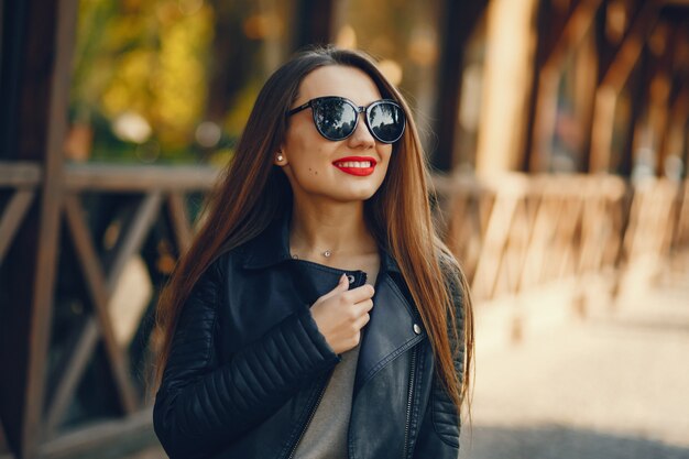 young and pretty girl walking in a summer city