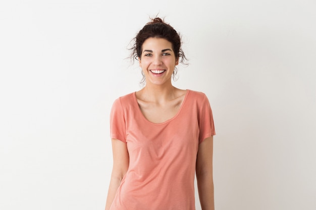 Young pretty natural woman, smiling, sincere emotion, positive, happy, isolated, pink t-shirt