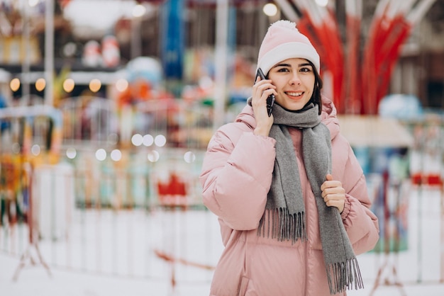 Young pretty woman in an amusement park