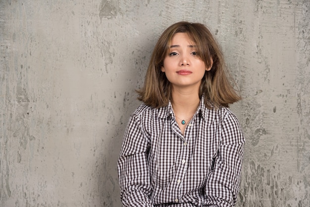 a young pretty woman sitting and posing 