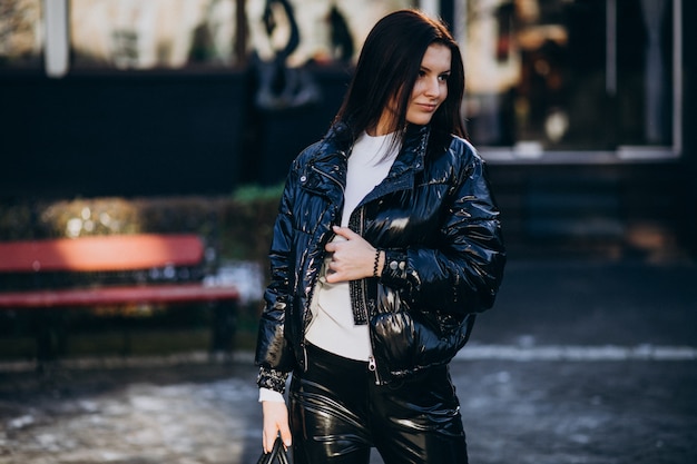 young pretty woman in warm jacket outdoors